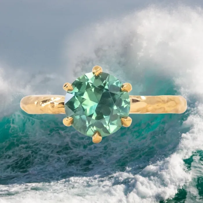 215ct Round Teal Nigerian Sapphire Six Prong Evergreen Solitaire in 18k Yellow Gold Anueva Jewelry PreStyled Sets 215ct Round Teal Nigerian Sapphire Six Prong Evergreen Solitaire in 18k Yellow Gold Anueva Jewelry PreStyled Sets