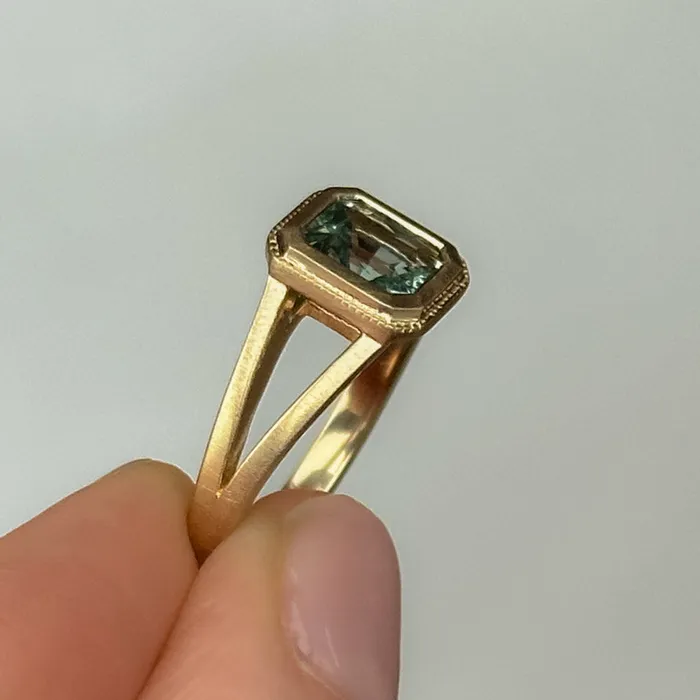 Anueva Jewelry Rings 120ct Radiant Cut Seafoam Montana Sapphire Split Shank Bezel Ring with Milgrain in 14k Yellow Gold