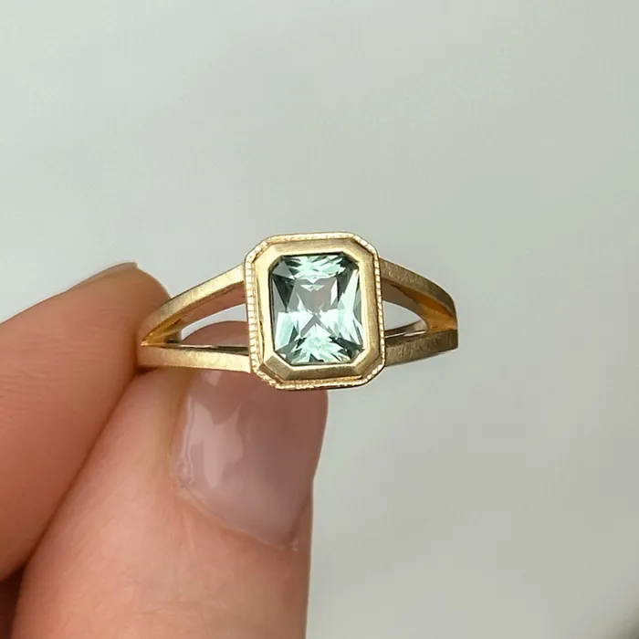 Anueva Jewelry Rings 120ct Radiant Cut Seafoam Montana Sapphire Split Shank Bezel Ring with Milgrain in 14k Yellow Gold